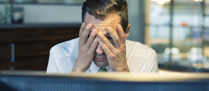 Man stressed using computer